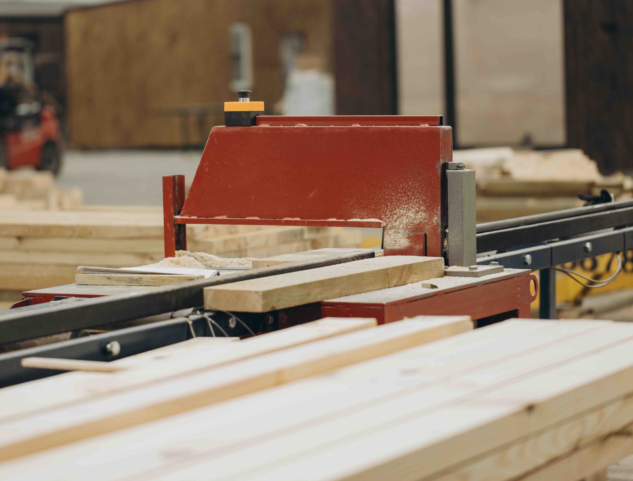 A photo of lumber cuts being made with specialized machinery.
