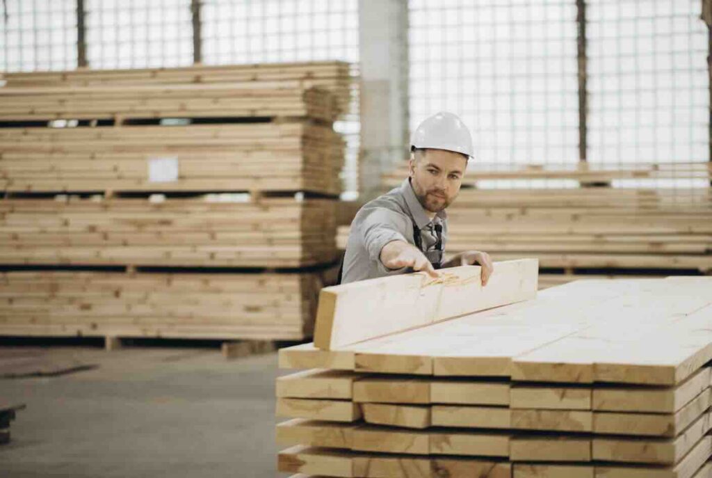 A photo of a man working on a pack cutting project.